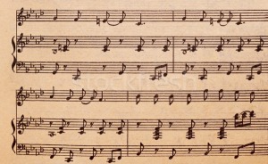 951986_stock-photo-music-notes-on-old-paper-sheet-to-use-for-the-background